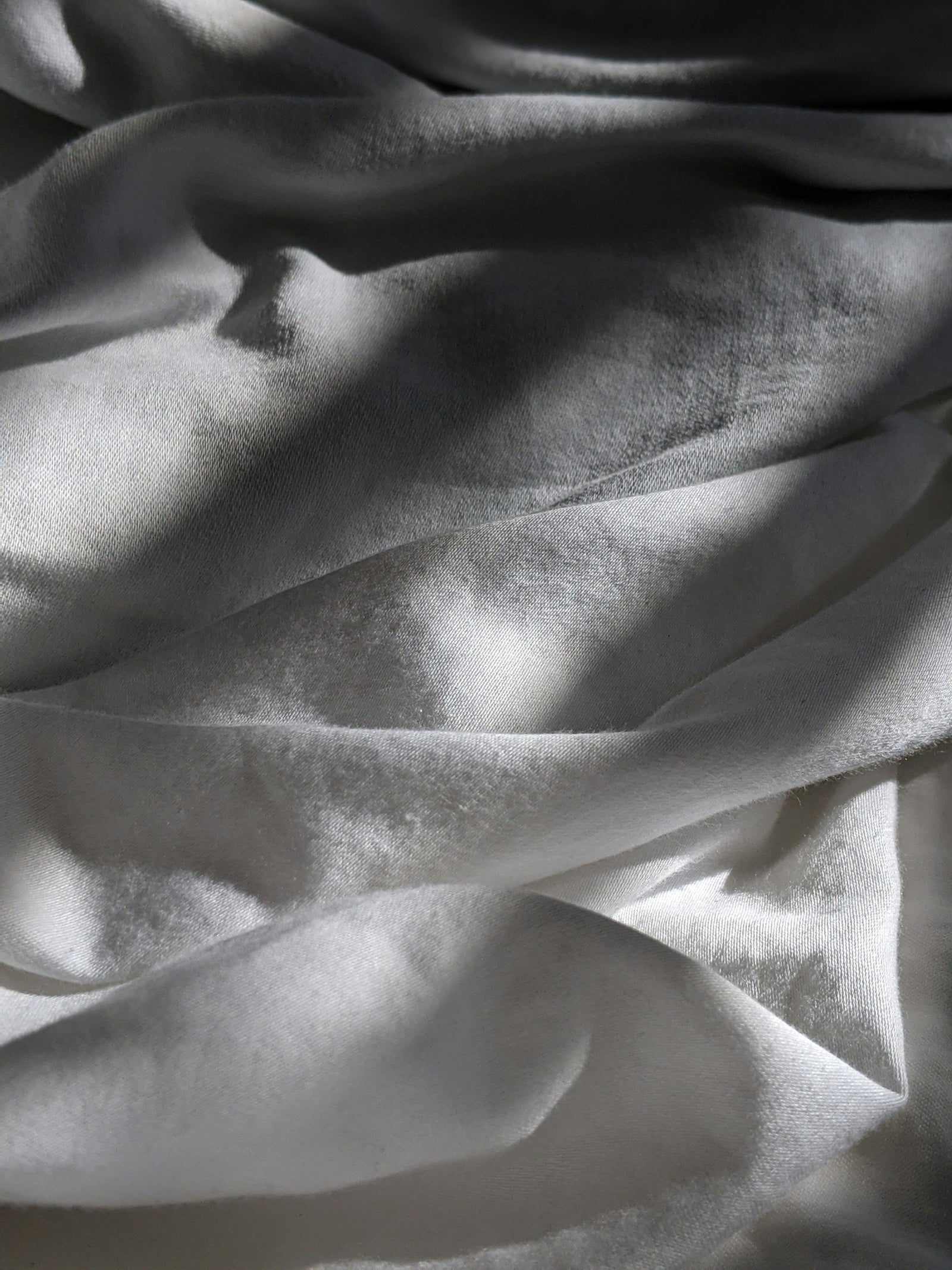 Draped organic cotton in raking light