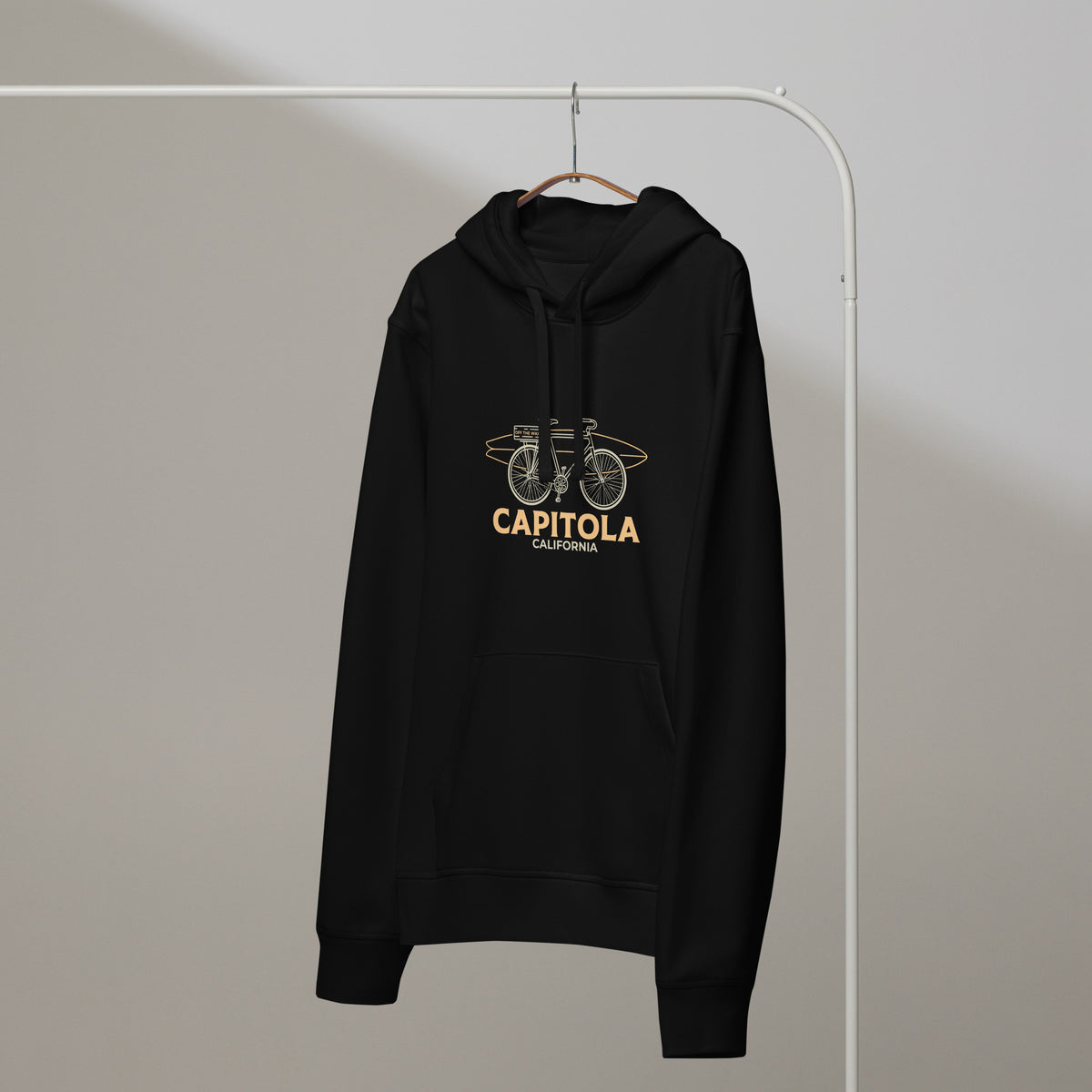 Capitola Mid-Weight Hoodie in Black on a hanger